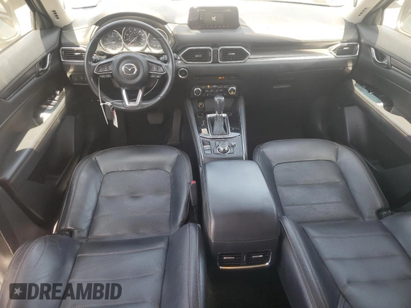 2018 Mazda CX-5 Grand Touring with VIN JM3KFADM3J1389911, listed as a Copart auction lot 60530295 with 103,177 mi miles and Salvage title. Bid and sale history available at DreamBid. Image 8.