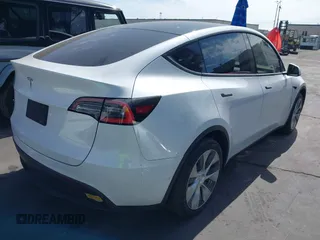 2021 Tesla Model Y Long Range with VIN 5YJYGDEE3MF081304, listed as a IAAI auction lot 41706240 with 90,510 mi miles and . Bid and sale history available at DreamBid. Image 4.