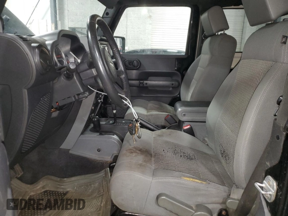 2009 Jeep Wrangler Rubicon with VIN 1J4GA64159L770895, listed as a Copart auction lot 82140864 with 209,464 mi miles and Salvage Title. Bid and sale history available at DreamBid. Image 7.