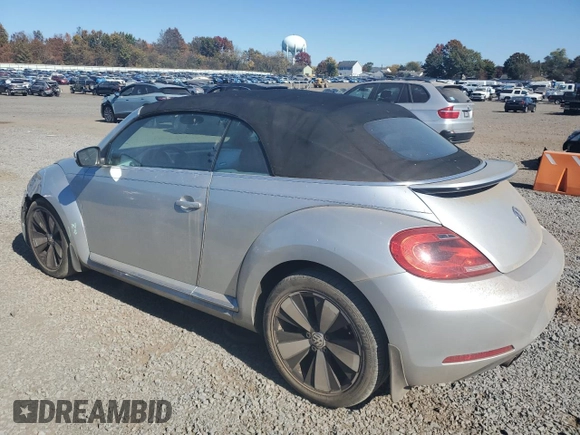 2013 Volkswagen Beetle 2.5L with VIN 3VW5P7ATXDM803952, listed as a Copart auction lot 76971934 with 211,449 mi miles and Salvage Title. Bid and sale history available at DreamBid. Image 2.