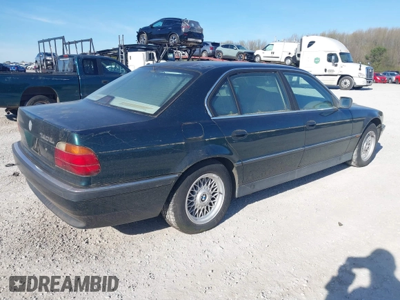 1998 BMW 7 Series 740il with VIN WBAGJ8323WDM13455, listed as a IAAI auction lot 41888636 with 1 mi miles. Bid and sale history available at carsss.com. Image 4.