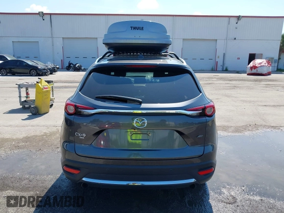 2022 Mazda CX-9 Grand Touring with VIN JM3TCBDY4N0618680, listed as a IAAI auction lot 40086806 with 34,142 mi miles and . Bid and sale history available at DreamBid. Image 16.
