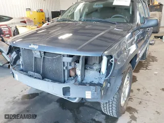 2003 Jeep Grand Cherokee Laredo with VIN 1J4GW48S33C539977, listed as a IAAI auction lot 42027703 with 100,534 mi miles. Bid and sale history available at carsss.com. Image 6.