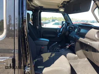 2023 Jeep Gladiator Sport S z VIN 1C6HJTAG8PL528821, wystawiony jako IAAI lot #41777653 z przebiegiem 65 656 mil mil oraz . Historia ofert i sprzedaży dostępna na DreamBid. Obrazek 5.