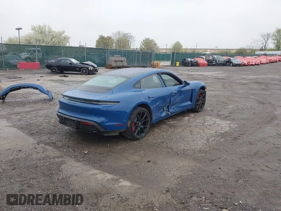 2022 Porsche Taycan GTS z VIN WP0AD2Y17NSA59692, wystawiony jako IAAI lot #41961572 z przebiegiem 12 680 mil mil oraz . Historia ofert i sprzedaży dostępna na DreamBid. Obrazek 4.