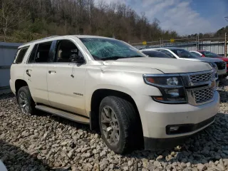 2015 Chevrolet Tahoe LT with VIN 1GNSKBKC7FR268013, listed as a Copart auction lot 45817295 with 125,884 mi miles and Salvage Title. Bid and sale history available at carsss.com. Image 4.