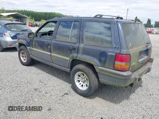 1994 Jeep Grand Cherokee Laredo z VIN 1J4GZ58Y2RC320793, wystawiony jako IAAI lot #42781115 z przebiegiem 275 518 mil mil oraz . Historia ofert i sprzedaży dostępna na DreamBid. Obrazek 3.