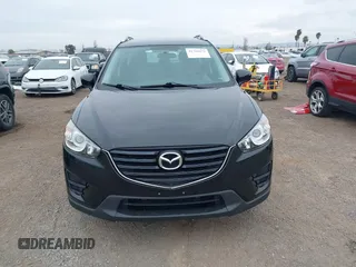 2016 Mazda CX-5 Sport with VIN JM3KE2BY4G0761933, listed as a IAAI auction lot 41709274 with 131,127 mi miles. Bid and sale history available at carsss.com. Image 13.