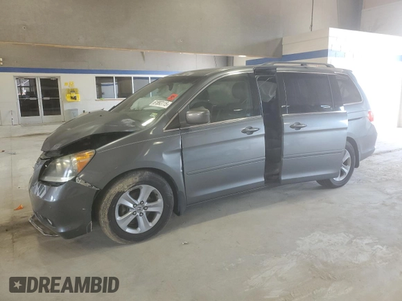 2010 Honda Odyssey Touring with VIN 5FNRL3H91AB113770, listed as a Copart auction lot 61893115 with 155,776 mi miles and Salvage title. Bid and sale history available at DreamBid. Image 1.