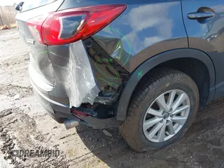 2016 Mazda CX-5 Sport with VIN JM3KE4BY5G0829927, listed as a IAAI auction lot 41678552 with 121,476 mi miles. Bid and sale history available at carsss.com. Image 19.