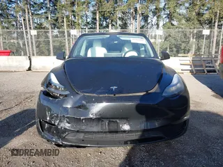 2023 Tesla Model Y Long Range z VIN 7SAYGDEE9PF637042, wystawiony jako IAAI lot #41969086 z przebiegiem 25 524 mil mil oraz . Historia ofert i sprzedaży dostępna na DreamBid. Obrazek 6.