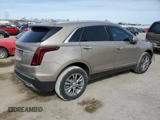 2022 Cadillac XT5 FWD Premium Luxury z VIN 1GYKNCRS9NZ180043, wystawiony jako Copart lot #51352195 z przebiegiem 12 399 mil mil oraz Szkoda całkowita • Salvage title. Historia ofert i sprzedaży dostępna na DreamBid. Obrazek 3.