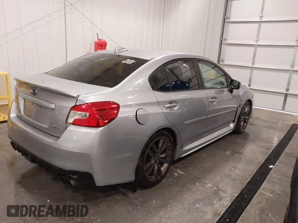 2016 Subaru WRX Premium with VIN JF1VA1E64G8811369, listed as a IAAI auction lot 41243335 with 129,319 mi miles. Bid and sale history available at carsss.com. Image 4.