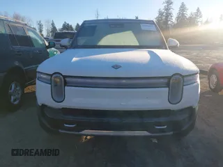2025 Rivian R1S Adventure z VIN 7PDSGBBA3SN052257, wystawiony jako IAAI lot #41289615 z przebiegiem 2746 mil mil oraz . Historia ofert i sprzedaży dostępna na DreamBid. Obrazek 13.