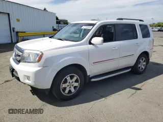 2011 Honda Pilot Touring z VIN 5FNYF4H95BB101924, wystawiony jako Copart lot #57164845 z przebiegiem 186 041 mil mil oraz Szkoda całkowita • Salvage title. Historia ofert i sprzedaży dostępna na DreamBid. Obrazek 1.