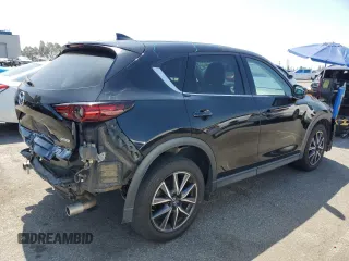 2018 Mazda CX-5 Grand Touring with VIN JM3KFBDM4J0348165, listed as a Copart auction lot 62733665 with 80,693 mi miles and Salvage title. Bid and sale history available at DreamBid. Image 3.