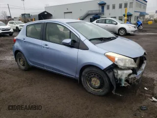 2012 Toyota Yaris L with VIN JTDKTUD33CD517298, listed as a Copart auction lot 52099335 with Not Provided miles and Salvage Title. Bid and sale history available at DreamBid. Image 4.