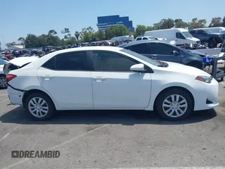 2018 Toyota Corolla L with VIN 5YFBURHE7JP810444, listed as a IAAI auction lot 42558647 with 74,794 mi miles and . Bid and sale history available at DreamBid. Image 14.