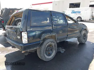 2000 Jeep Cherokee Classic with VIN 1J4FF58S5YL134745, listed as a IAAI auction lot 40352984 with 1 mi miles. Bid and sale history available at carsss.com. Image 4.