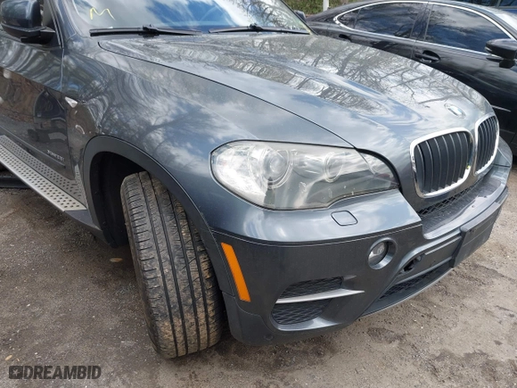 2011 BMW X5 35i with VIN 5UXZV4C56BL406632, listed as a IAAI auction lot 41981590 with 168,534 mi miles. Bid and sale history available at carsss.com. Image 6.
