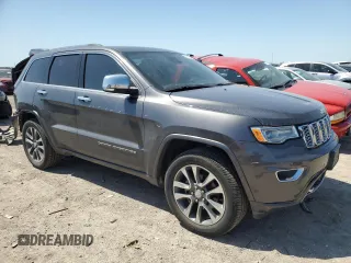 2017 Jeep Grand Cherokee Overland with VIN 1C4RJFCGXHC941983, listed as a Copart auction lot 52008825 with 65,776 mi miles and Salvage Title. Bid and sale history available at carsss.com. Image 4.