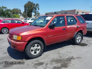 1999 Isuzu Rodeo S z VIN 4S2CK58W4X4362837, wystawiony jako IAAI lot #42403621 z przebiegiem 177 690 mil mil oraz . Historia ofert i sprzedaży dostępna na DreamBid. Obrazek 2.