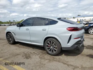 2025 BMW X6 M60i with VIN 5UX43EX06S9W68023, listed as a Copart auction lot 69874764 with 3,789 mi miles and Salvage Title. Bid and sale history available at carsss.com. Image 2.