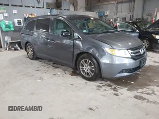 2012 Honda Odyssey EX-L with VIN 5FNRL5H63CB137198, listed as a IAAI auction lot 42706690 with 305,753 mi miles and . Bid and sale history available at DreamBid. Image 1.