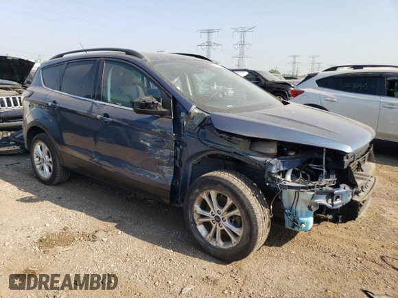 2018 Ford Escape SE z VIN 1FMCU9GD3JUA98865, wystawiony jako Copart lot #56842065 z przebiegiem 112 439 mil mil oraz Szkoda całkowita • Salvage title. Historia ofert i sprzedaży dostępna na DreamBid. Obrazek 4.