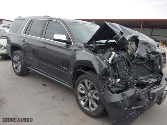 2015 Chevrolet Tahoe LTZ with VIN 1GNSCCKC7FR614886, listed as a IAAI auction lot 41679585 with 104,695 mi miles. Bid and sale history available at carsss.com. Image 1.
