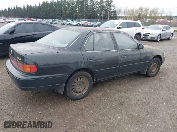 1994 Toyota Camry LE z VIN JT2GK12E1R0036423, wystawiony jako IAAI lot #41922375 z przebiegiem 211 529 mil mil oraz . Historia ofert i sprzedaży dostępna na DreamBid. Obrazek 4.