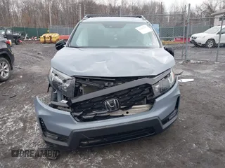 2022 Honda Passport Elite z VIN 5FNYF8H06NB015583, wystawiony jako IAAI lot #41633925 z przebiegiem 49 738 mil mil oraz . Historia ofert i sprzedaży dostępna na DreamBid. Obrazek 12.