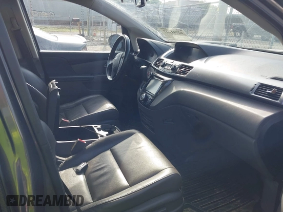 2014 Honda Odyssey Touring with VIN 5FNRL5H99EB111685, listed as a IAAI auction lot 42141227 with 183,484 mi miles and . Bid and sale history available at DreamBid. Image 5.