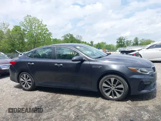 2019 Kia Optima LX z VIN 5XXGT4L32KG298796, wystawiony jako IAAI lot #42266827 z przebiegiem 89 841 mil mil oraz . Historia ofert i sprzedaży dostępna na DreamBid. Obrazek 13.