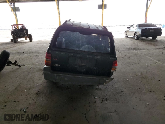 1996 Jeep Grand Cherokee Laredo with VIN 1J4GZ58S6TC304597, listed as a Copart auction lot 52962545 with Not provided miles and Salvage title. Bid and sale history available at DreamBid. Image 6.