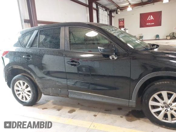 2016 Mazda CX-5 Touring with VIN JM3KE2CY7G0867355, listed as a IAAI auction lot 41963169 with 117,727 mi miles and . Bid and sale history available at DreamBid. Image 13.