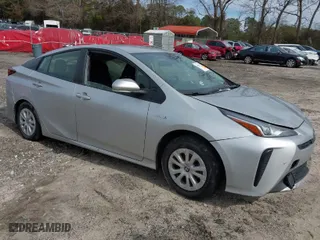 2021 Toyota Prius L Eco with VIN JTDKAMFU1M3152848, listed as a IAAI auction lot 41600212 with 140,114 mi miles. Bid and sale history available at carsss.com. Image 1.