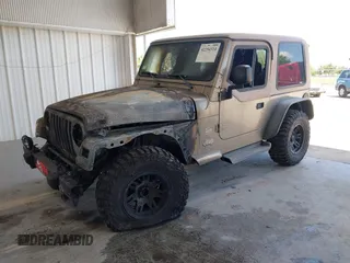 2003 Jeep Wrangler Sahara z VIN 1J4FA59S63P336928, wystawiony jako IAAI lot #42254314 z przebiegiem Nie podano mil oraz . Historia ofert i sprzedaży dostępna na DreamBid. Obrazek 2.