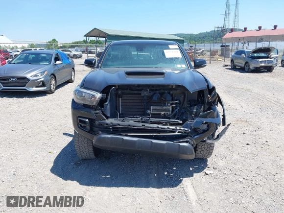 2019 Toyota Tacoma SR with VIN 5TFCZ5AN4KX208354, listed as a IAAI auction lot 42771410 with 77,509 mi miles and . Bid and sale history available at DreamBid. Image 13.