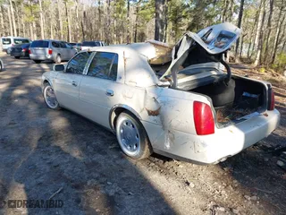 2002 Cadillac DeVille DHS with VIN 1G6KE57Y42U216449, listed as a IAAI auction lot 41611917 with 73,054 mi miles. Bid and sale history available at carsss.com. Image 3.
