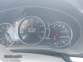 2021 Mazda CX-5 Grand Touring with VIN JM3KFADM6M1373111, listed as a IAAI auction lot 42784431 with 14,374 mi miles and . Bid and sale history available at DreamBid. Image 7.
