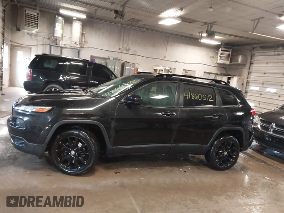 2014 Jeep Cherokee Latitude with VIN 1C4PJMCS0EW291135, listed as a IAAI auction lot 41860372 with 171,524 mi miles and . Bid and sale history available at DreamBid. Image 14.
