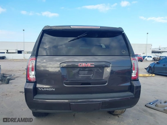 2016 GMC Yukon SLT with VIN 1GKS2BKC1GR406739, listed as a IAAI auction lot 41247286 with 106,023 mi miles. Bid and sale history available at carsss.com. Image 17.