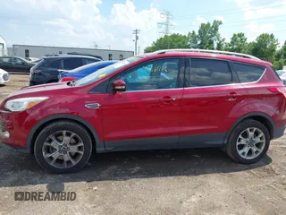 2015 Ford Escape Titanium z VIN 1FMCU9J91FUC58933, wystawiony jako IAAI lot #42583736 z przebiegiem 147 359 mil mil oraz . Historia ofert i sprzedaży dostępna na DreamBid. Obrazek 14.