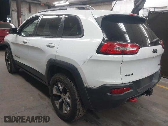 2015 Jeep Cherokee Trailhawk with VIN 1C4PJMBS1FW665500, listed as a IAAI auction lot 42068268 with 127,246 mi miles. Bid and sale history available at carsss.com. Image 3.