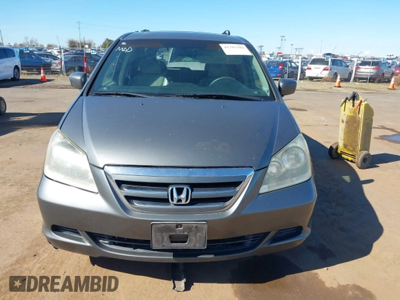 2007 Honda Odyssey EX-L z VIN 5FNRL386X7B405321, wystawiony jako IAAI lot #41703384 z przebiegiem 198 552 mil mil oraz . Historia ofert i sprzedaży dostępna na DreamBid. Obrazek 6.