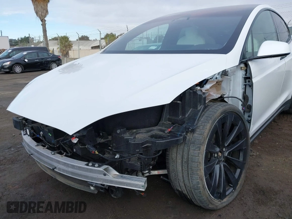 2023 Tesla Model X with VIN 7SAXCBE54PF384403, listed as a IAAI auction lot 40947187 with 16,881 mi miles and . Bid and sale history available at DreamBid. Image 6.