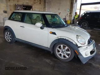 2007 MINI Hardtop with VIN WMWMF33597TL67297, listed as a IAAI auction lot 41972674 with 94,458 mi miles and . Bid and sale history available at DreamBid. Image 1.