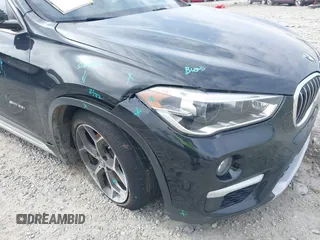 2017 BMW X1 sDrive28i with VIN WBXHU7C36HP924874, listed as a IAAI auction lot 41368396 with 113,443 mi miles. Bid and sale history available at carsss.com. Image 6.