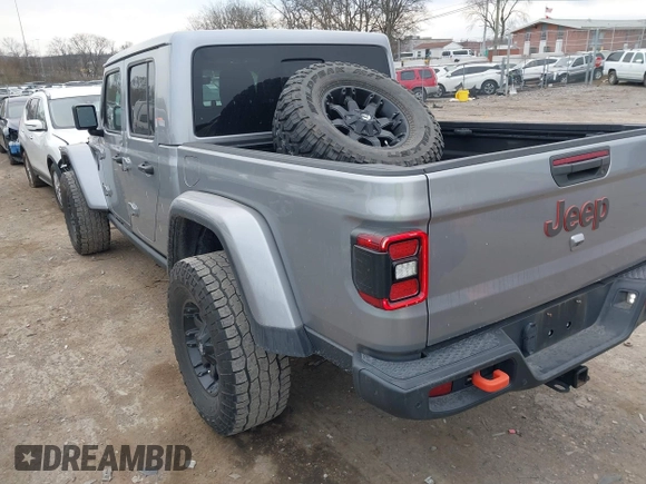 2021 Jeep Gladiator Mojave with VIN 1C6JJTEG9ML519309, listed as a IAAI auction lot 41701544 with 64,461 mi miles and . Bid and sale history available at DreamBid. Image 3.